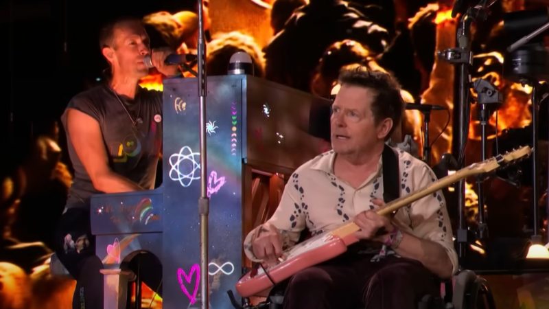 Watch the 'pure joy' as Coldplay bring Michael J. Fox on stage to play guitar at Glastonbury