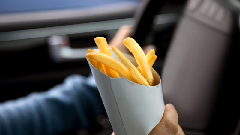 Dunedin driver crashes into a post while choking on a hot chip